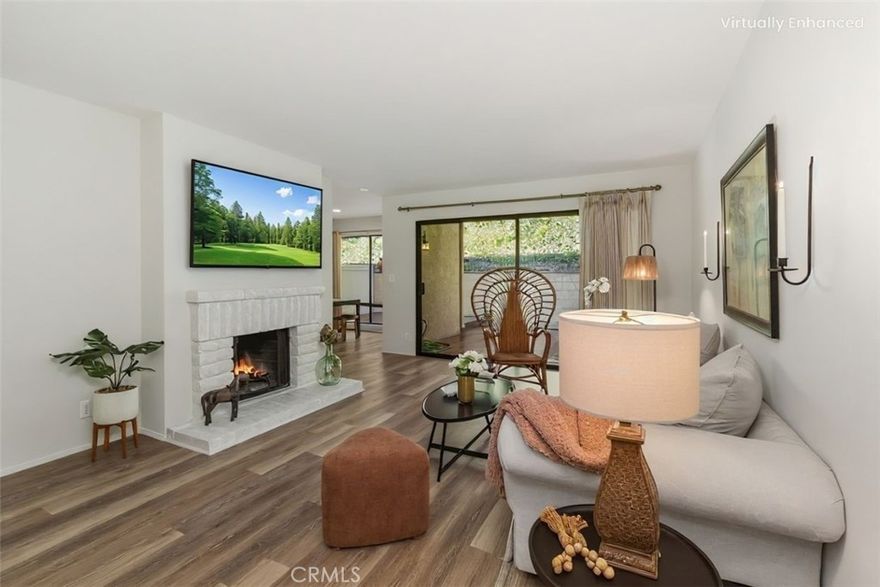 This beautiful townhome is located in a sought-after area of Fullerton, includes 2 ensuite bedrooms and 2 1/2 bathrooms with new upgraded flooring and paint throughout, and new on-trend upgrades in 2 of the bathrooms. The living and dining rooms both open up to tranquil views of the private back patio and deck, which are perfect for enjoying the California lifestyle. This model features a large living room with a fireplace and a dining room adjacent to the kitchen and breakfast bar, with a freshly remodeled powder room completing the first level. Upstairs, you'll find 2 en-suites bedrooms, with the expansive primary including a dressing area, enormous walk-in closet, and private balcony. At the same time, just down the hall, the second ensuite bedroom is a generously-sized bedroom with abundant natural light, a walk-in closet, and an ensuite with a new on-trend vanity. Enjoy a private back patio and deck within the resort-style community of Country Villas, which includes a pool and spa, a tennis court, and plenty of guest parking. Several golf courses are nearby as well as shopping, dining, and entertainment, with top-rated schools of Sunset Lane Elementary, Parks Middle, and, of course, the sought-after Sunny Hills High School.