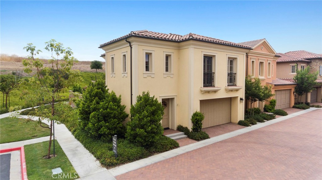 Sophisticated Southern California Luxury in The Village of Laguna Altura, Irvine — Discover A One-of-A-Kind Private Retreat situated on one of THE BEST Private CORNER Lot Locations with Unprecedented Panoramic Hillside Views from Every Vantage Point, Extended Backyard, and NO Homes Behind! Experience a Hillside Destination with Tranquil Walking Trails– Our Siena Collection Residence Three “Italianate” features 3BD 2.5BA and 1,868 Sq. Ft of decadent indulgence! The home offers Premier Designer-Inspired interior finishes throughout including Rich Hardwood Flooring, “Grey Ghost” Interior Paint, Custom Fitted Window Shades & Plantation Shutters, and Recessed Lighting throughout! Chef-inspired Gourmet Kitchen with Custom Caeserstone Countertops, Ceramic Brick Backsplash, White Glass-Fronted Cabinetry, and ALL Stainless Steel Appliances! A Lifestyle Opportunity for Outdoor Living— An Entertainer’s Delight with RARE Lot Premium, Expansive Backyard, & Hillside Views! World-Class Amenities—exclusive to Laguna Altura residents. Leisurely activities at your doorstep—Paved Walking Trail to Los Olivos Shopping Center, Parks, Full Court Basketball, Junior Olympic Pool, Clubroom, Tot lots, and BBQ Picnic destinations. Award-winning Irvine Unified School District and minutes from Irvine Spectrum Center, Quail Hill Shopping Center and Laguna Beach!