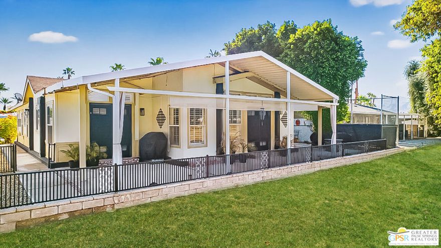 Don't miss this OPPORTUNITY to own one of the best manuf homes in THE BEST & most highly sought after 55+/Active Adult golf course community in the valley desert. This 2001, 2bed + Den & 2bath 1800+ sq foot home with attached 2 car garage will NOT LAST LONG.  Resort living, this senior guard gated community offers security, tranquility and many member/social activities to include multiple pools/spas, clubhouse, golf with member discounts, onsite restaurant, tennis/pickleball...even a dedicated doggie park. This home offers many enhancements to include but not limited to: open floor concept in kitchen/dining/living great room, laminate flooring throughout (with exception of primary and guest bedroom which are carpeted), granite countertops with backsplash in kitchen plus refinished countertops in both bathrooms plus laundry room and hallway, all new appliances, all new interior and exterior lighting. Primary bedroom comes with double door entry plus a walk in closet. Primary bathroom comes with double vanities, large jacuzzi tub and a walk-in shower. Guest bathroom also has a walk-in closet. Exterior enhancements include but not limited to hot tub, shade roller blinds, desert landscaping, accent lighting. 2 car garage comes with added shelving for storage.  Rarely lived in by present owner but completely upgraded for the next owner, YOU!!  Come See, you will not be disappointed.  Of special note: home is covered by a generator to cover any electricity disruptions.