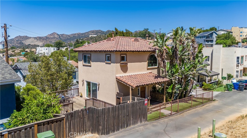 Turnkey and full of charm, this sun-drenched Mediterranean-style home is nestled in the serene Twin Lakes community of Chatsworth. Built in 2007, it offers 2 bedrooms plus a versatile downstairs office that can easily serve as a third bedroom (It has a closet), along with 2.5 bathrooms. The open-concept kitchen features granite countertops and flows seamlessly into a bright living room with a cozy fireplace. Expansive windows fill the home with natural light and frame beautiful mountain and canyon views. A private deck off the living area is perfect for morning coffee or relaxed summer evenings. The spacious primary suite offers a warm fireplace, walk-in closet, private bath, and stunning canyon vistas. The downstairs office provides flexible living options. Outside, a small yard presents the opportunity to create your own outdoor retreat. Other features include Direct access two car garage, copper plumbing, Tankless water heater; HVAC; Ceiling Fans, Laundry conveniently located Upstairs; Recessed Lighting and much more. With great curb appeal, peaceful surroundings, and move-in ready condition, this home is a true gem.