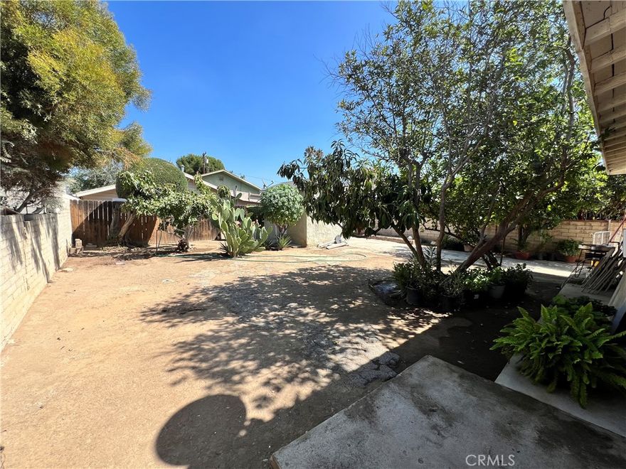 Great investment property. Large backyard with storage building. RV access.  Front porch, granite counter tops in kitchen with oak lower cabinets. Wood floors in home. Smooth ceilings and ceiling fan. Separate laundry facilities. Fruit trees in rear yard. Updated main line. RV parking on one side and single car garage on the other side. Nice front porch. Needs some TLC. Situated on a nice street.