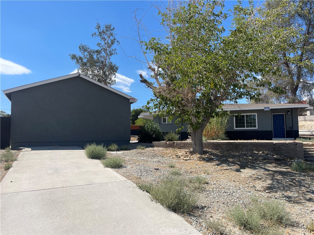 Charming 3-bedroom, 2-bath home on a spacious 40,764 sq ft lot. Features new interior and exterior paint, some new fixtures throughout, new flooring, spacious living room with a fireplace, dinning area next to the kitchen, newer cabinetry, washer and dryer room, good size bedrooms, detached 2-car garage, convenient location near schools, shopping, and dining. A great opportunity!
