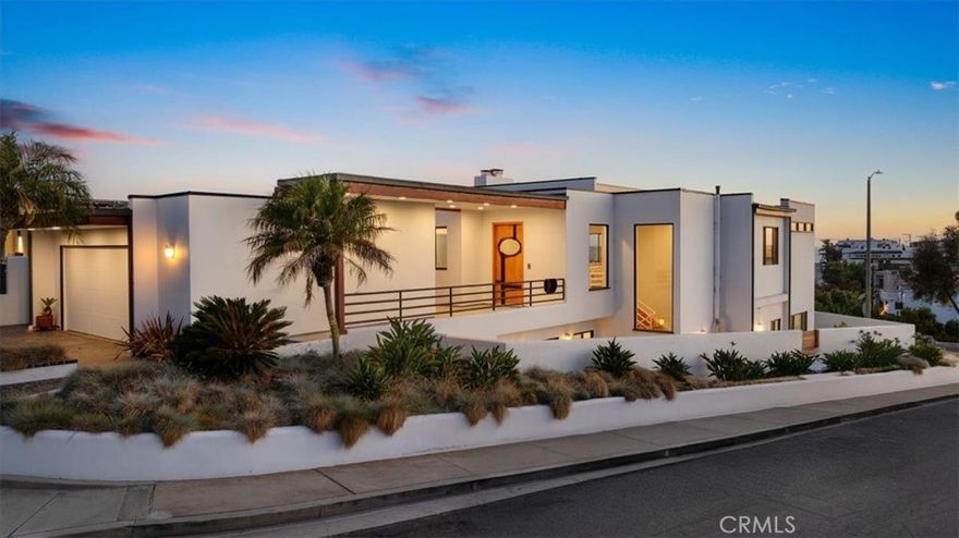 Located on one of the best streets in highly sought-after North Hermosa, this is the first time this incredible home has ever been on the market.  This beautiful mid-century modern, custom built property is nestled on a rare cul de sac with west facing ocean views.  It is immaculate and timeless, featuring soaring high ceilings complete with wood tongue & groove. This home was built ahead of it’s time, with a family friendly reverse floor plan that you would see in today’s new construction homes and an open-concept layout that is bathed in natural light. The top floor maximizes the ocean views and the beach breeze and has a gorgeous and spacious living room, dining room, and a professional grade kitchen with a newer stainless SubZero, a center island, breakfast nook and custom made solid wood cabinetry. There is also a deck off the living space that is perfect for enjoying coffee or cocktails at any time of day. There is also an additional room on the upper level that is a perfect office retreat, additional family room or could be used as a bedroom. The downstairs level features 3 other spacious bedrooms including the private master suite, and an incredible light and bright recreation room that could be utilized as a study room, a playroom, art room or additional casual family room space. Just outside this downstairs living space is an incredible yard with plenty of space to relax, sun, and enjoy. There is also an oversized laundry room on this level and storage space. This home places you just blocks away from the beach, vibrant dining and outdoor recreation. It is perfectly centered between downtown Manhattan Beach and downtown Hermosa Beach.  Across the green belt, Valley Park provides the perfect setting for outdoor activities, family picnics and community events. This home has proximity to award-winning schools, including Hermosa View Elementary, Hermosa Valley School and Mira Costa High School, all known for their top-tier academics and exceptional educational programs. This is more than a home, it's a legacy property of rare distinction, an offering that won't last.