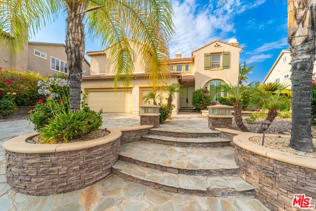 View, View, View. Indulge in breathtaking panoramic views of the lake and green belt from this exquisite residence in the prestigious Tuscany Hills community. This stunning two-story home in immaculate condition, extremely well kept, offers 5 spacious bedrooms, a versatile loft, and 4.5 baths, including a convenient downstairs bedroom suite. Open floor plan with sweeping Canyon Lake vistas as your backdrop. The gourmet kitchen featuring granite countertops, stainless steel appliances (including a double oven), custom cabinetry, and a walk-in pantry. upgraded marble tile flooring, two fireplaces, master suite, with its private balcony, dual sinks, and large walk-in closet, A dedicated 'teen' suite, Jack/Jill bathroom, countless upgrades. A very well designed water feature along side the house provides a tranquil and serene setting to relax and enjoy. Experience the pinnacle of lakeside living.