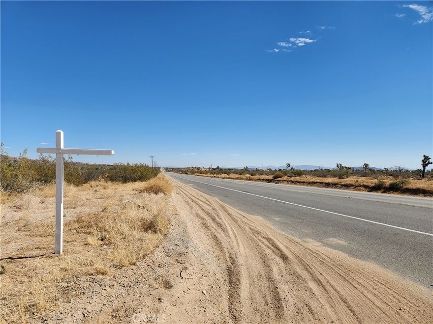 2.3 Acre Residential Corner Lot,  NE corner of Highway 247 and Chaparral Rd. (APN: 0629-032-44) GPS: 34.218817, -116.439915 This 2.3 acre corner lot is located in Yucca Valley, CA. San Bernardino County has zoned this property Homestead Valley/Rural Living (HV/RL). The primary use is residential homes, some of the other permitted uses within this zoning are: accessory crop production, agricultural accessory structure, small family daycare facility or licensed residential care facility. Commercial renewable energy facilities are permitted in RL zoning according to the San Bernardino Development Code. 300 Ft of Highway Frontage! Overhead electricity is approx 300 Ft W of the property. Bighorn-Desert Water Agency services the area and provides water. Residents have septic tanks for their sewer needs and propane tanks for their gas needs. Floodway maps show the property is NOT in any flood zones and there is NO blue line on the property. Living in Yucca Valley, CA, offers the perfect blend of desert charm and modern conveniences. Imagine waking up to the gentle rustle of Joshua trees and the warm desert sun casting its glow over the landscape. With easy access to Joshua Tree National Park, residents can explore miles of hiking trails, marvel at unique rock formations, and experience the awe-inspiring beauty of the desert. Yucca Valley's vibrant community scene boasts eclectic shops, delicious eateries, and local art galleries, providing endless opportunities for exploration and connection. Whether you're seeking adventure in the great outdoors or a cozy night in with friends, Yucca Valley welcomes you with open arms and the promise of a fulfilling desert lifestyle. This property does not yet have an address. While the boundary lines on the map offer a glimpse, they are only approximate. A Buyer should verify boundaries, zoning and utilities, ensuring every aspect aligns with their vision for the property.