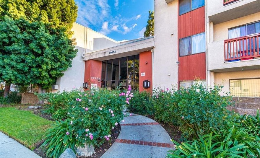 Welcome to this bright and spacious one-bedroom, one-bathroom condo located in the heart of Winnetka, just minutes from freeways, shopping, dining, and entertainment. Situated on the second floor of a well-maintained complex, this beautifully updated unit offers comfort, convenience, and style. Step into a large living room filled with natural light, leading to a private balcony that overlooks the sparkling swimming pool and relaxing Jacuzzi. The bedroom features a generous walk-in closet, and the unit includes a mix of modern laminate flooring and cozy carpet. Additional amenities include two assigned tandem parking spaces, community laundry facilities on every floor—including one conveniently located just next to the unit—and a central location within the complex for easy access to all features. There is also a nearby exit close to the parking area, making coming and going a breeze. Whether you're a first-time buyer or looking to downsize, this move-in-ready condo is a fantastic opportunity to own in the vibrant San Fernando Valley.