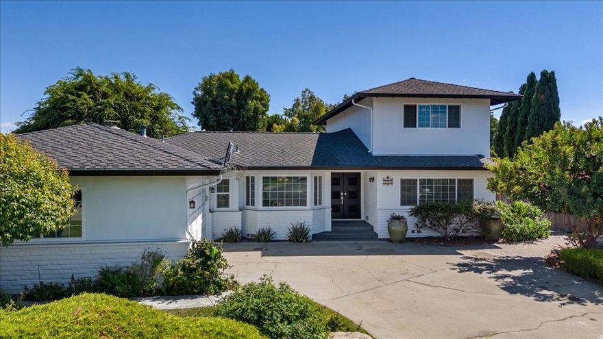 Looking for a spacious home in South Salinas? This well-maintained residence offers 5 bedrooms, including a smaller bedroom, and 3.5 bathrooms, situated in an excellent cul-de-sac location. Everything you need is nearby shopping centers, schools, a private and quiet neighborhood. The home features upgrades and a thoughtful layout. The second story was added in 1990, comprising two bedrooms and a full bathroom. One of the bedrooms is particularly large and has a private door to the bathroom. A small deck off the hallway.  The kitchen boasts  granite countertops, stainless steel appliances, and two ovens, with an eating bar that extends into the family room, perfect for casual dining and gatherings. On the main floor, you'll find three bedrooms, including the master suite, along with a hall bathroom. A half bath is conveniently located next to the laundry room and garage entrance.  Outdoor living is equally impressive, featuring a nicely paved side yard with a custom-built barbecue pit, water fountain, and covered patio ideal for entertaining family and friends. The other side yard includes play areas, as well as mature fruit trees and vegetable beds for growing organic produce. This home combines comfort, functionality, and outdoor enjoyment in a desirable South Salinas location.