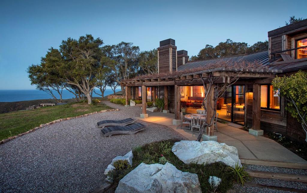 HAVE IT ALL IN BIG SUR Extraordinary panoramic ocean & south coast views, sound of crashing waves, private beach access, trails meandering through a massive ancient redwood forest with waterfalls and year round streams, 3 water sources and extreme privacy provide the backdrop for this stunning 4 bedroom, 3 bath fully permitted, deeply infrastructured luxury home with 2 wood burning fireplaces, radiant heated floors, gourmet kitchen, media room, office, wine cellar and Jacuzzi, all nestled in a picturesque oak forest adjacent to the property's enormous flat 'savannah' meadow with its own spectacular view of Pico Blanco, the Santa Lucia range and the ocean. Should anyone want more on this pristine 60 acre property sitting above Pfeiffer Beach, it is ideal for whatever compound expansion one might imagine going forward. This level of comprehensiveness in a property is virtually unheard of anywhere, making this offering all the more rare for a lover of Big Sur who is ready to have it all.