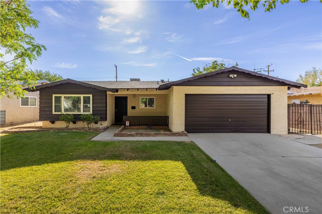 Welcome to 44527 Denmore Avenue, a beautifully updated single-story home in East Lancaster. This residence offers 4 bedrooms, 2 bathrooms, and an open floor plan designed for comfort and functionality. The remodeled kitchen showcases granite countertops, stainless steel appliances, and abundant counter space for cooking and entertaining. Two separate living rooms provide versatile spaces, one featuring a fireplace and sliding door access to the backyard. The rear yard is spacious and includes a covered patio ideal for outdoor dining or relaxation. Warm interior tones and excellent curb appeal create a welcoming atmosphere from the moment you arrive. Opportunities like this don't come along often—schedule your tour today to experience all this home has to offer!