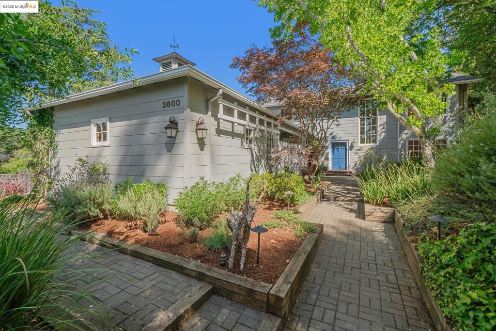 Stunning Joaquin Miller Home! Step into nearly 3,000 sq. ft. of stylish living on an oversized lot. Soaring ceilings, hardwood floors, and a two-sided fireplace with built-in cabinets set the stage. A renovated kitchen shines with a sleek cooktop, breakfast bar, custom cabinets, and dual pantries. The adjacent formal dining room and living room open up to a terraced back yard, perfect for entertaining. Three bedrooms on the first floor have a guest bath plus a double-entry bath and a separate laundry room. Retreat upstairs to the luxe primary suite with a soaking tub, double sinks and a walk-in closet. Bonus spaces include a large media/rec room and a home office. Comfort all year with central AC/heat. New on demand water heater. Blending elegance and modern upgrades, this home delivers space, function, and style in one perfect package! It's a truly lovely home situated close to hiking, biking, and horse trails. Just blocks to the popular Woodminster Theater with summer performances and Music in the Redwoods. A real destination spot right outside your door. Friendly neighbors gather together to create a real sense of community. A wonderful place to call HOME!