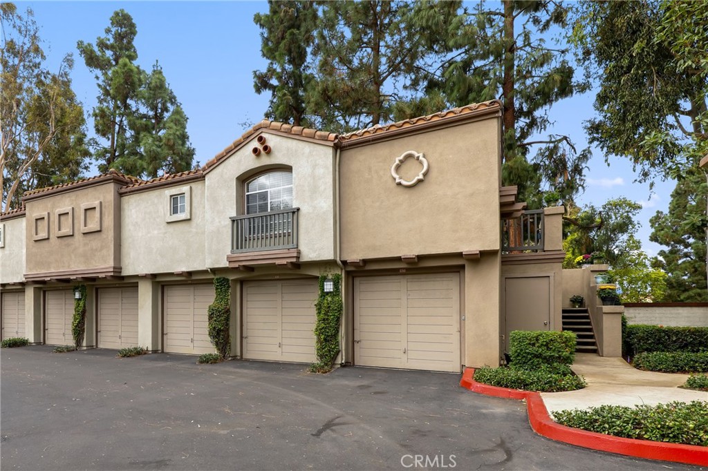 MOVE IN READY & Low HOA fee! Corner carriage-style condo with no one above or below! Your own 1 car garage is under the condo AND you also have 1 carport in front! This desirable end unit offers 2 bedrooms, 2 bathrooms, and approximately 1,000 square feet of living space. Enjoy the convenience of your own one-car garage with storage closet, plus an additional carport! The home features an open layout with abundant natural light from three sides, wood vinyl flooring throughout, and walk-in closets in both bedrooms. Relax on your private patio overlooking the greenbelt, or take advantage of the community’s amenities including two pools, a spa, clubhouse, gym, and tot lot. Ideally located in the sought-after Mandevia community, you’re within walking distance to Tustin Sports Park, Tustin Ranch Elementary, and The Marketplace, with easy access to major freeways.