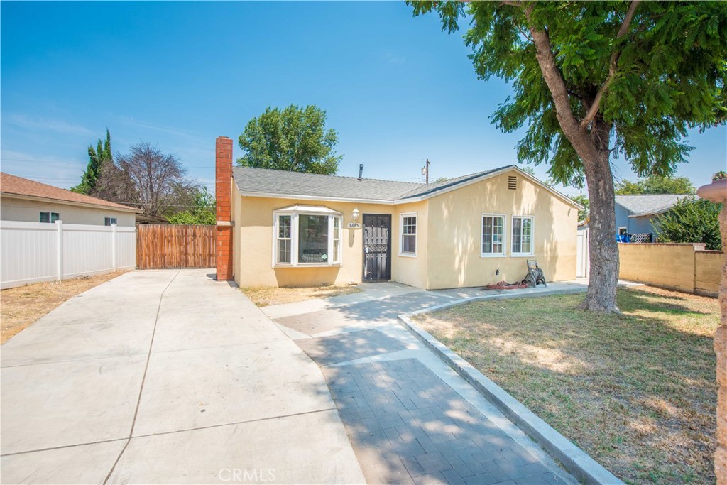 Welcome to 8885 Jo Jo Way – a beautifully remodeled single-story home in the highly sought-after Arlington neighborhood of Riverside. Featuring 3 bedrooms and 2 full bathrooms, this home offers approximately 1,224 sq ft of updated living space on a spacious 6,534 sq ft lot. Inside, you’ll find a modern kitchen with granite countertops, newer cabinets and brand new wood look laminate vinyl tile flooring throughout. The cozy living room includes a fireplace and ample natural light. All bedrooms feature walk-in closets and new flooring. Both bathrooms have been tastefully renovated a few years back with updated vanities, tile work in one of the bathrooms, and new fixtures. The home has been extensively upgraded, including a 3 year old HVAC system, dual-pane windows, updated electrical panel, newer plumbing, and a new roof (2016). A standout feature is the enclosed patio/laundry area, providing bonus space and functional convenience. Outside, enjoy a huge backyard fully enclosed with white vinyl fencing, perfect for entertaining, pets, or parking all your toys — RV, boat, or more. There's also an additional storage shed in the back yard and a sprinkler system in the front yard. Located close to schools, shopping, dining, and major freeways (91, 60 & 15), with no HOA or Mello-Roos, this move-in ready home checks every box for families, first-time buyers, and investors alike.