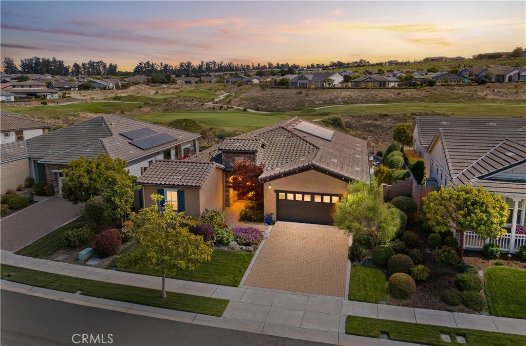 Enjoy stunning golf course views from this move-in ready home at 1539 Vista Tesoro Place in Nipomo’s sought-after Trilogy at Monarch Dunes community!
This inviting 3-bedroom, 2-bathroom residence offers 1,734 square feet of thoughtfully designed living space, blending comfort, style, and functionality.
Inside, the open floor plan creates a seamless flow, perfect for both relaxed living and entertaining. A cozy interior fireplace enhances the living area, while the home’s one-owner care is evident throughout.
Outdoors, the patio extends the living space with coordinating tile, a ceiling fan, and an exterior fireplace—ideal for gatherings or peaceful evenings overlooking the Challenge Course.
The rare Monterey II floor plan adds versatility, with the third bedroom easily adaptable as a guest suite, office, or flex space. The southeast-facing backyard frames sweeping golf course views, providing tranquil mornings and vibrant sunsets.
Additional highlights include a two-car garage with a bump-out for storage or a workshop.
Located in Trilogy at Monarch Dunes, an award-winning active lifestyle community, residents enjoy access to world-class amenities, including golf, pickleball, fitness, dining, and a vibrant social calendar.
Blending indoor comfort, outdoor beauty, and resort-style living, this Nipomo gem is truly ready to welcome you home.