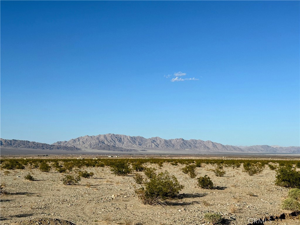 5 secluded acres! Enjoy forever views and explore the areas endless off-road trails. Camp under the stars. Secluded lot provides sought after privacy. No utilities. Dirt road access. 15 minutes from the Joshua Tree National Park entrance in 29 Palms. Property does not have an assigned address - for listing purposes only. GPS: (34.1325075, -115.8966855) APN: 0625-282-20-0000. The seller is also offering other parcels in the same area. Take a look today!