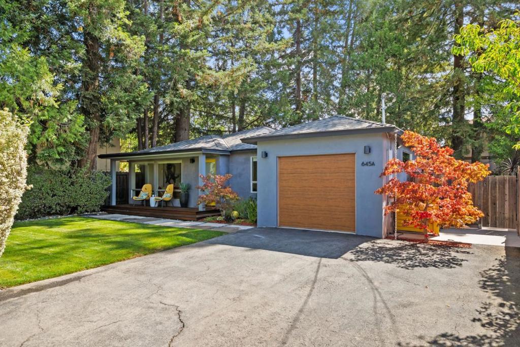 Set back from the street in privacy, this bright, modern home balances contemporary design with a warm and inviting character. Step inside to an open floorplan that seamlessly connects the living room, dining area, and chef's kitchen with premium appliances from Bluestar and Fisher & Paykel. Three bedrooms provide comfort and flexibility, with one easily convertible into a home office, and a finished bonus space in the garage adds even more versatility. Majestic redwoods shade the serene backyard, where a lawn and an expansive deck offer plenty of space for entertainment or relaxation. The location is exceptional, with Briones Park just steps away, top-ranked schools including Briones Elementary, Fletcher Middle, and Gunn High all within walking distance, and the shops and dining of The Village at San Antonio Center close at hand, with everything Palo Alto has to offer within easy reach.