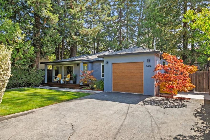 Set back from the street in privacy, this bright, modern home balances contemporary design with a warm and inviting character. Step inside to an open floorplan that seamlessly connects the living room, dining area, and chef's kitchen with premium appliances from Bluestar and Fisher & Paykel. Three bedrooms provide comfort and flexibility, with one easily convertible into a home office, and a finished bonus space in the garage adds even more versatility. Majestic redwoods shade the serene backyard, where a lawn and an expansive deck offer plenty of space for entertainment or relaxation. The location is exceptional, with Briones Park just steps away, top-ranked schools including Briones Elementary, Fletcher Middle, and Gunn High all within walking distance, and the shops and dining of The Village at San Antonio Center close at hand, with everything Palo Alto has to offer within easy reach.
