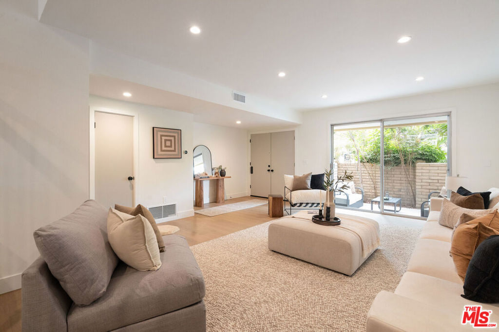 Extensively renovated 3 bedroom, 2.5-bathroom townhome situated on a cul-de-sac street in a quiet interior pool side location offering views of the landscaped grounds and pool. This modernized unit that's flooded with natural light includes designer details throughout such as wide plank oak floors, recessed LED lighting, custom built-ins, rift white oak cabinets, quartz counter-tops, and more. Offering a spacious living room and an entertainer's kitchen with quartz countertops, stainless steel appliances, custom cabinetry, and an open flowing center island configuration that's adjacent to a separate dining area. Upstairs the primary suite boasts an en-suite spa-like bathroom with a designer dual vanity, custom tile, separate shower and soaking tub, and tons of closet space. Additionally, upstairs offers two well-sized bedrooms and a shared bathroom. This unit also includes a separate in-unit laundry room, powder room, upgraded central air and heat with Nest thermostat, and a 3 car finished garage with an epoxy coated floor with plenty of extra storage. Villa Beaulieu offers a pool, 2 saunas, and beautifully landscaped courtyard. Close to all the Marina has to offer!