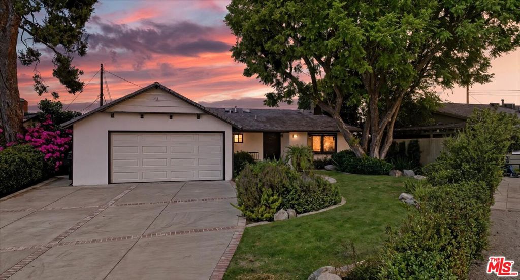OFFER DEADLINE: Monday, 10/13 at 6PM. Welcome to 6172 Dalecrest Ave! This single-level home, tucked away on a quiet cul-de-sac, offers sweeping valley and mountain views. Its charming curb appeal, featuring a mature Jacaranda tree and front porch, welcomes you in and sets the stage for the perfect family home. Step inside to discover a light-filled interior with three bedrooms and two bathrooms. The primary suite boasts an oversized walk-in rainfall shower, dual quartz vanity, and generous closet space with a cozy sitting area - an ideal retreat to relax at the end of the day. The other two bedrooms enjoy stunning views and share a hallway bathroom with dual sinks and a bathtub. The living room, anchored by a fireplace, is brightened by a garden window, creating a warm and inviting space for gatherings. The kitchen is designed for both cooking and everyday living, featuring quartz countertops, subway tile, new stainless steel appliances, and a breakfast bar for casual meals. The dining area sits by French doors that open to a patio, perfect for alfresco dinners with city views and seamless indoor-outdoor entertaining. The backyard is equally inviting, with a grassy lawn, covered brick patio offering panoramic views, and a mature avocado tree perfect for quiet mornings or gatherings. Recent updates include a 2024 HVAC, dual-pane windows, fresh paint, insulation, new water heater, a Ring system, and more. An attached two-car garage provides convenient storage.Located just minutes from top-rated schools, parks, shopping, and dining, this move-in-ready home offers the ideal opportunity to enjoy the best of Woodland Hills living.