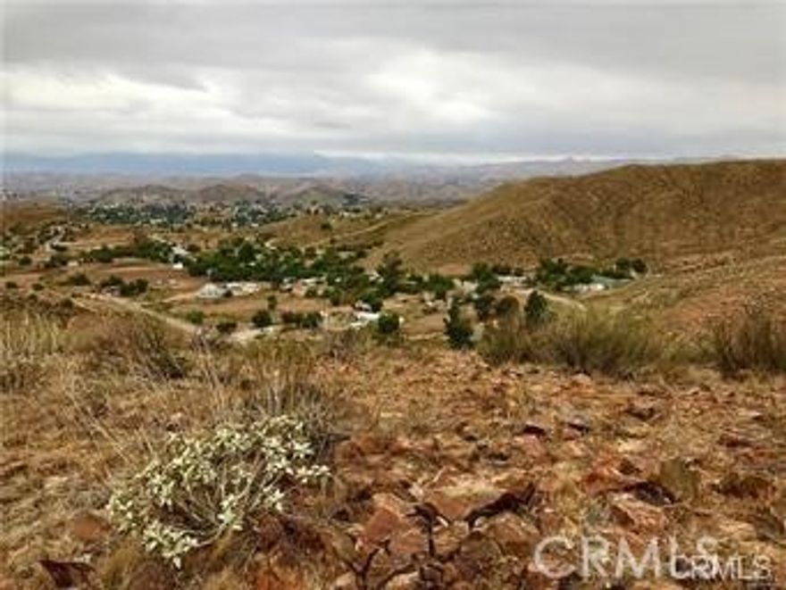 Beautiful hilltop property on approx 4.5 acres with 360 degree views.  This property is perfect for building your dream home or investment. Property sits on top of a hill overlooking Sun City, Menifee, and surrounding valley  Sunrise or sunset you can't go wrong with this view.  It exemplies country living yet close to schools, shopping and recreation.  Centrally located between 15/215