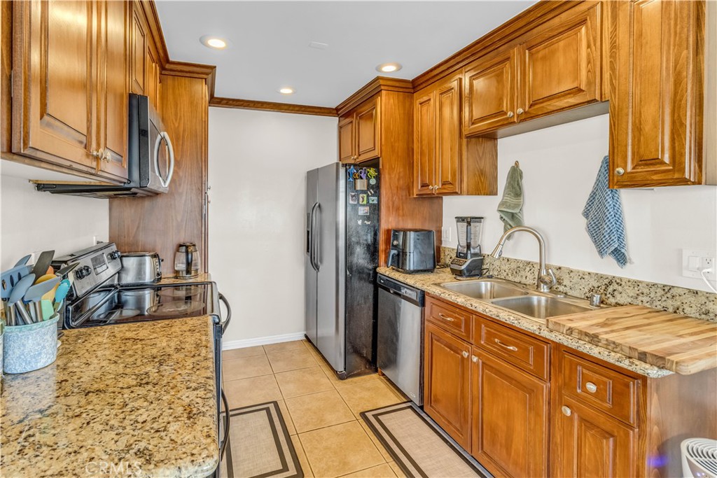 Welcome home to this charming 2-bedroom, 1-bath condo located in the desirable gated community of Cinnamon Tree in Placentia! Priced attractively at $437,888, this bright and inviting unit boasts 845 square feet of thoughtfully designed living space. Step into the deluxe kitchen featuring modern stainless steel appliances, perfect for the home chef. The spacious master bedroom offers an expansive closet, while the second bedroom provides a generous walk-in closet, ideal for guests or additional storage. Enjoy comfort year-round with the efficient wall air conditioner in the welcoming living area.
Conveniently located near major freeways, shopping centers, parks, the local library, and esteemed schools—including just minutes from Cal State Fullerton—this condo offers unparalleled accessibility. Additional perks include a private storage area right next to your front door, one assigned covered carport space, plus potential for additional permitted parking. HOA amenities include water, trash, and sewer services, along with access to two sparkling community pools and a relaxing spa.
Perfectly maintained by a smoke-free owner, this delightful condo is ready for its next chapter. Don't miss this fantastic opportunity to live in one of Placentia's most convenient and charming communities!