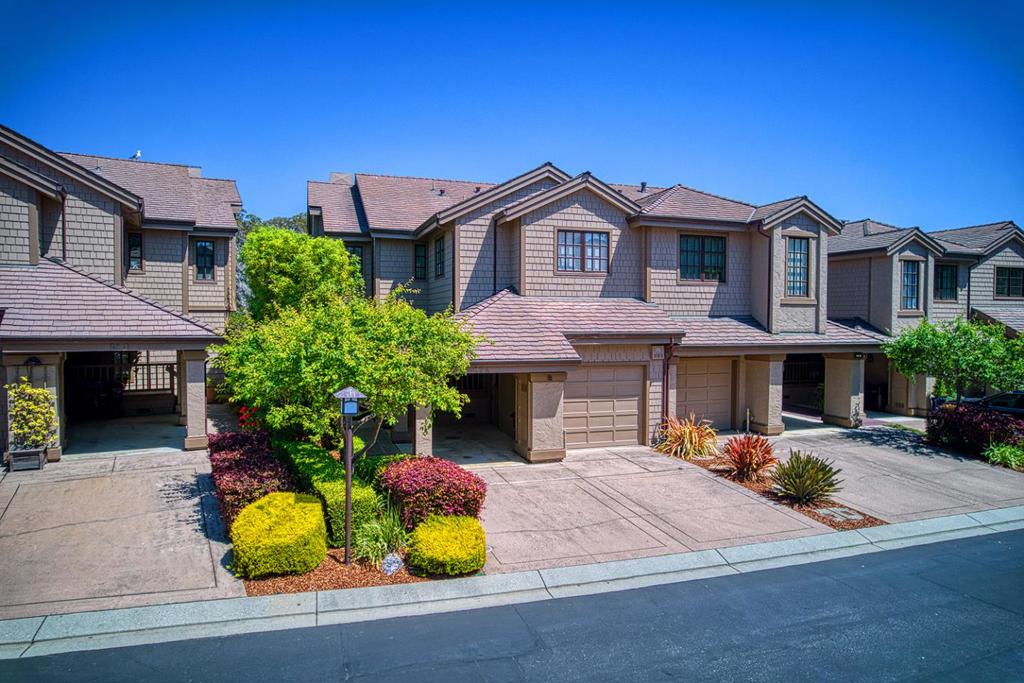 Overlooking the upper harbor, with views out to the Monterey Bay. A private, gated community. This larger end unit has been completely transformed with a high-end, extensive remodel. The home features a living room and dining room with barrel-vaulted ceilings. The entry has an elevator, taking you to the second floor. Enhanced with multifold patio doors, skylights, and a linear gas fireplace. The Chef's kitchen has Wolf appliances, a built in Miele Coffee System, a motorized, drop-down TV, concealed in the ceiling when not in use. There are custom cabinets and lighting, the Bosh refrigerator has a wine cooler. The home is set up with a Sonos sound system. The primary suite has been enhanced with an expanded bathroom with a walk in closet and heated floor. The third bedroom has been converted to a family room and office space with its own terrace. The office has built in ring lights for zoom calls. Garage and three other parking spaces. Tesla electric car charger in the carport. Garage has a remote operated privacy screen. Circulating hot water pump. Leave the world behind and enjoy your private paradise with morning sunshine and beautiful sunsets. Enjoy front row seats to the annual Lighted Boat Parade, along with having a pathway, out the back door, to the harbor and the beach.