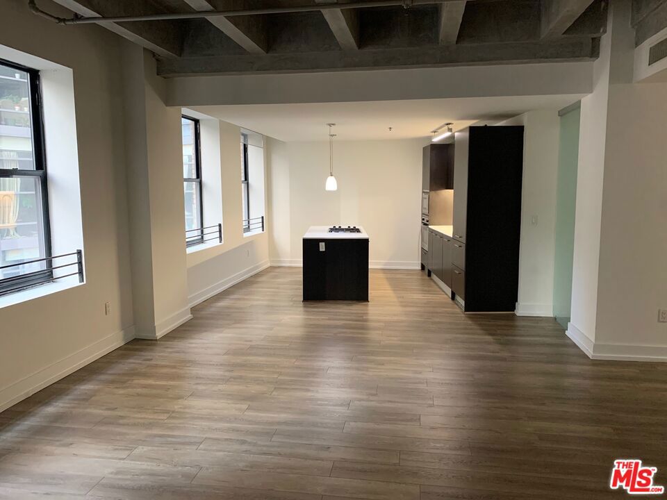 #725 is a loft apartment with 1 bedrooms and 2 bathrooms. "Look and Lease Special." Take up to EIGHT weeks FREE rent on our exclusive move-in promotion. 4 weeks free, 4 weeks on 'Look and Lease" for total of 8 weeks free. Offer subject to change without notice, prices change weekly, book your appointment ASAP and ASK FOR DETAILS ON THIS WEEK'S PROMOTION. Welcome to a pet-friendly community offering exceptional comfort and convenience. This bright, spacious loft features soaring ceilings and abundant natural light. Enjoy premium amenities including: 24/7 fitness center, secure Parcel Pending locker system that notifies you instantly via text of package deliveries to lockers, 24/7 concierge service and valet parking with text retrieval anytime day or night, Bosch brand kitchen appliances: gas range, microwave, dishwasher, and in-unit washer/dryer. Refreshing rooftop pool and hottub, indoor/outdoor lounges with oversized TVs and comfortable seating. Private wine room with lockers and meeting space for gatherings or quiet work. Beautifully furnished guest suite available for residents' visitors, ideal for hosting friends and family. Live in a vibrant neighborhood with Whole Foods, Ralphs, Smart & Final, Target, and Grocery Outlet nearby, plus The Bloc* shopping district is just across the street, featuring Uniqlo, USPS, Alamo Drafthouse Cinema, Drybar, GNC, LaMay Nail Salon, Starbucks, Sheraton Grand Hotel, T-Mobile, Hatch Yakitori, Marugame Udon, Oil + Cream Massage, One Medical, UCLA Health. Building is perfectly positioned above the 7th St/Metro Center station, providing quick access to all subway lines, LA Live, and the LA Convention Center within minutes. Street level of our building is Northern Cafe and Jollibee. Multiple loft options are available in various layouts and price ranges. Prices and lease specials updated weekly. Schedule your tour today to discover luxury, convenience, and peace of mind in one of the most desirable addresses in downtown Los Angeles financial district. Complimentary valet parking while touring.