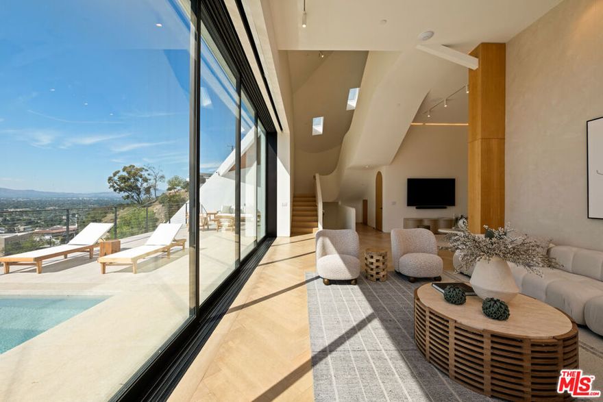Perched at the highest point on Alta Mesa Drive, this stunning new-construction modern home offers sweeping panoramic views of Studio City and surrounding canyons. The residence features double-height ceilings, expansive windows, and an open, flowing floor plan that blends indoor and outdoor living. A gourmet kitchen with premium appliances, spa-inspired baths, and advanced smart home systems ensure luxury at every turn. Multiple terraces and balconies create versatile entertaining spaces under the stars. With privacy, prestige and convenience steps from Harvard-Westlake, this is a rare leasing opportunity in one of Studio City's most coveted neighborhoods. The owner is seeking 13+ month leases at a minimum. The listed price is unfurnished but thanks to great relationships with our staging company we can arrange to keep the furniture for an additional fee.
