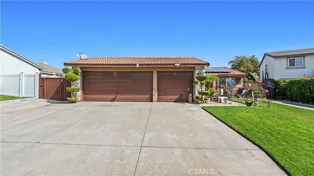 Welcome to this inviting single-story home in one of Rialto's most desirable neighborhoods. With great curb appeal, a three-car garage, RV entrance and a spacious driveway, this property is as practical as it is charming. Inside, the home features a 3 bedrooms and 2 bathrooms with a comfortable open layout. Step outside to your private backyard oasis complete with a pool, tropical landscaping, and a covered patio. Whether you're hosting summer barbecues or just enjoying a quiet evening, this backyard is designed for making memories. Conveniently located near schools, shopping, and freeway access, this home offers both comfort and convenience. Schedule your appointment today and make this home yours!