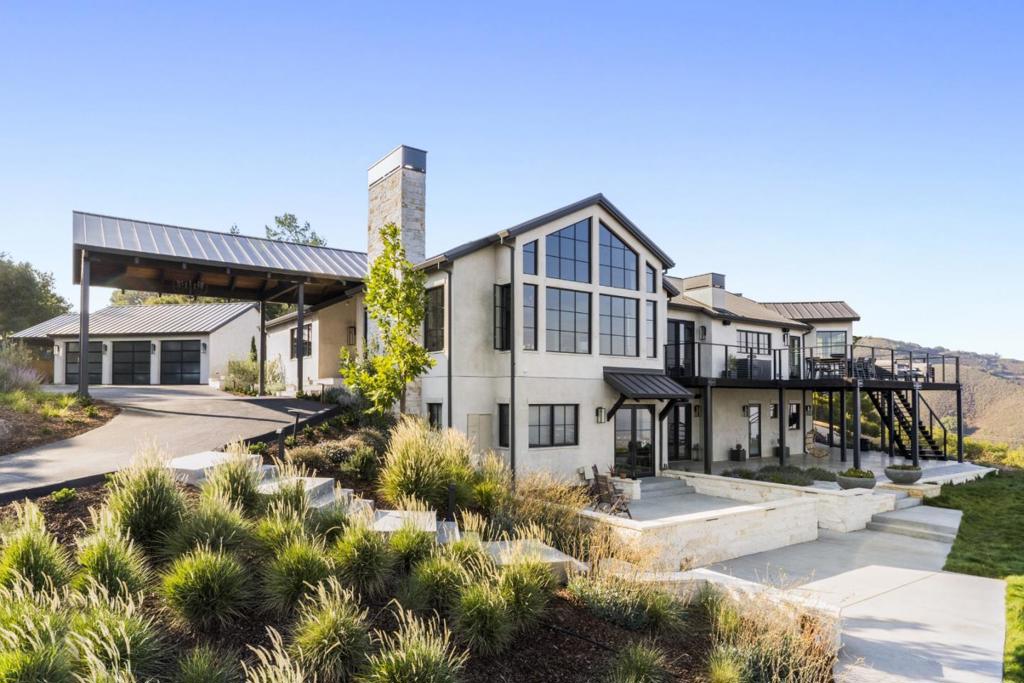 Nestled in the hills above Los Gatos, this exceptional estate blends stunning design with like-new construction in one of the Bay Areas most breathtaking settings. A place where the rhythms of nature shape daily life, the journey home unfolds along a scenic road lined with majestic oaks and seasonal wildflowers. Initially unfamiliar, the drive soon becomes a feature and a transition from city life to your private sanctuary. Completely rebuilt in 2020 and meticulously maintained since, this smart, eco-friendly home offers sweeping panoramic views of Silicon Valley and the Santa Cruz Mountains, seamless indoor-outdoor living, and direct access to miles of hiking and biking trails. The thoughtfully designed 6-bedroom, 4.5-bath residence includes a 1-bedroom, 1-bath in-law suite with private entrance, as well as a detached three-car garage and home gym. Sprawling grounds and a spacious deck provide the perfect canvas for entertaining. Just 10 minutes from downtown Los Gatos and 20 minutes from San Jose International Airport, this estate offers the perfect balance of luxury, privacy, and connection to nature. More than a home, it is a lifestyle, one that celebrates health, wellness, community, and the beauty of the natural landscape.