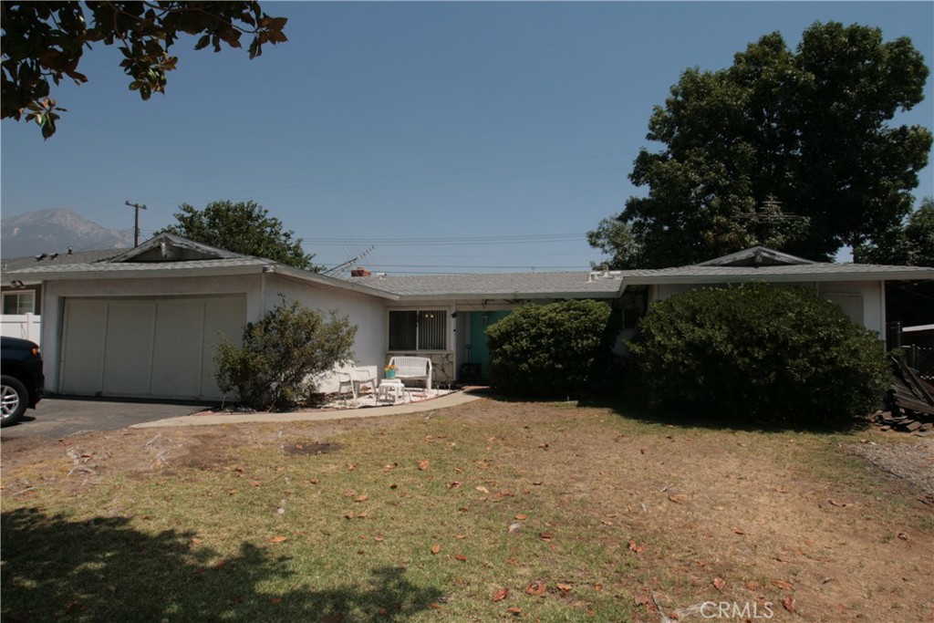 Nice quiet tree lined street in secluded neighborhood close to schools, four bedrooms (currently configured as a three bedroom), two full bathrooms, family style kitchen with dining area, spacious living room with beautiful custom masonry fireplace, easy formal dining room possibilities, large lot with plenty of room for convenient RV or boat parking, double car garage with direct access to the home, roomy front yard plenty of green grass and shade tree, this home has a great original family style floor plan, property needs some TLC Seller intends to sell "as is"