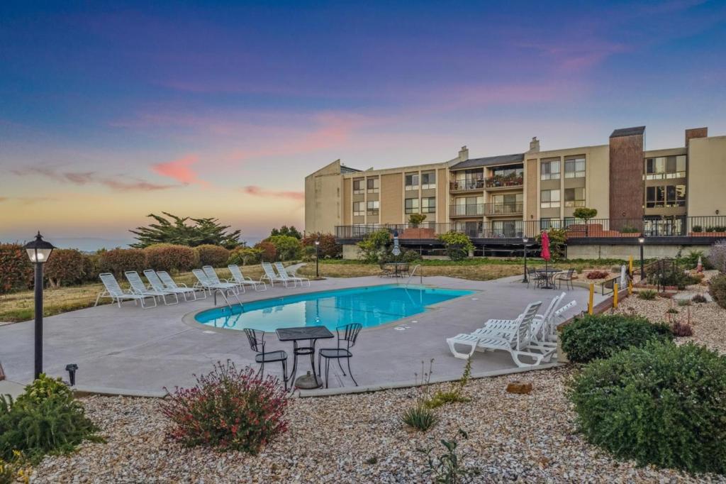 Nestled in the scenic Mills Estate hills, this ground floor 1BR/1BA with a flexible space that can be used as an additional room, office, dining room or home gym blends comfort, style, and a prime Millbrae location. Light-filled and spacious, the open layout features a generous living room that flows seamlessly to a private patio-perfect for morning coffee, relaxing evenings, or entertaining guests. The gourmet kitchen is equipped with sleek countertops, abundant cabinetry, and a convenient breakfast bar, ideal for casual dining. The generously sized bedroom offers a peaceful retreat with a walk-in closet, while the well-appointed bathroom completes the interior. Enjoy resort-style amenities in the desirable Bayview Condominiums, including a sparkling pool, spa, BBQ area, and a beautifully landscaped courtyard with sweeping views of the Bay and SFO. Additional features include one deeded parking space in a secured underground garage, plus proximity to top-rated Millbrae schools, BART, SFO, parks, shopping, and quick access to Hwy 280-perfect for commuters to San Francisco or Silicon Valley.