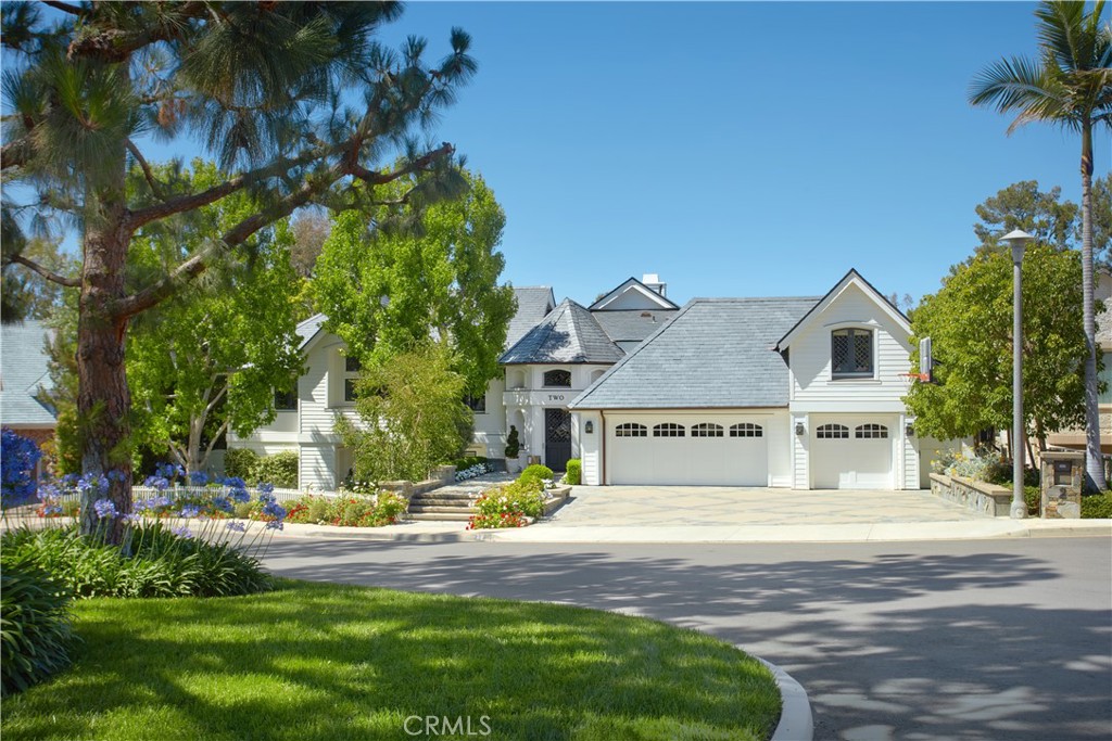 Gracefully perched along the iconic 15th hole in the heart of Newport Beach’s exclusive guard-gated community of Big Canyon, this masterfully reimagined estate captures front-row fairway views and the serene beauty of a striking par-3 played over water. A true architectural showpiece, the home was taken down to the studs and transformed by the renowned Amber Interiors, blending bespoke finishes with timeless California elegance.
Inside, rich walnut floors, custom millwork, designer lighting, and hand-selected wallpapers create a layered, textural experience that feels both refined and warmly livable. The interiors evoke a curated calm—where organic materials, soft architectural lines, and thoughtful craftsmanship create an ambiance that is both elevated and inviting.
Designed for modern living, the home is powered by solar energy and enhanced with integrated smart home features including Control4 automation, surround sound, video surveillance, and more. Outside, a resort-inspired backyard features a PebbleTec saltwater pool, lush landscaping, and multiple entertaining spaces, making large-scale gatherings effortless.
Upstairs, the sun-drenched primary suite offers a tranquil escape with sweeping fairway views, luxurious finishes, dual closets, and a spa-like bathroom retreat that provides peaceful seclusion.
Homes of this caliber are rare—crafted with premium materials, top-tier construction, and a level of customization that would be extraordinarily costly to replicate today. From the quality of the build to the attention to detail, this estate represents a standard that truly stands apart.
Just moments from Fashion Island, Newport Harbor, world-class beaches, and top-tier schools, this exceptional residence offers not just a home, but a lifestyle of design, ease, and distinction—set within one of Orange County’s most prestigious communities.