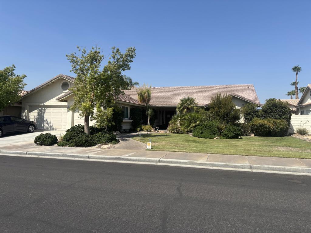 Desirable 4BD/3BA home located in the sought-after Cactus Flower community of North La Quinta! Situated on a quiet cul-de-sac with no front neighbors and views of the greenbelt, this spacious 2,134 sq. ft. home features a flexible floor plan, formal living room with fireplace, separate dining area, and open family room. The upgraded kitchen includes granite countertops, stainless/black appliances, custom tile backsplash, pantry, and refinished white cabinetry. Primary suite offers vaulted ceilings, walk-in closet, and en-suite bath with dual sinks, soaking tub, and separate shower. Additional features include two guest bedrooms, den/optional 4th bedroom with built-ins, interior laundry, and freshly painted interiors. The 3-car garage. Enjoy a private backyard with paver patio, lush landscaping, and storage shed. Located in the IB World School district, close to parks, schools, and shopping. No HOA and in low-cost IID electric district.