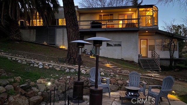 Tranquil Mountain Retreat Adjacent to Malibu Creek State Park
Welcome to your private sanctuary in the heart of the Malibu Lake area—an extraordinary property nestled on approx, 18k s.f. of breathtaking natural beauty, directly adjacent to the iconic Malibu Creek State Park. Surrounded by dramatic mountain vistas, rugged stone outcrops, and endless hiking trails, this property offers a rare opportunity to own a piece of California paradise.
This beautifully updated 4-bedroom, 3-bathroom home spans approximately 2600 square feet and is thoughtfully designed for both comfort and style. Vaulted wood-beamed ceilings, unique block/concrete construction and an airy, light-filled atmosphere that invites the outdoors in. The open-concept floor plan seamlessly integrates the custom kitchen, dining area, and living room—ideal for everyday living and effortless entertaining.
Step outside to expansive decks, an outdoor living experience made for al fresco dining, sunset lounging, and stargazing under clear canyon skies.
A spacious lower-level family room offers tremendous flexibility—perfect as a media room, guest suite, creative studio, or potential ADU for extended family or rental income.
The multi-tiered yard is a blank canvas for your imagination. Whether you envision a pool, vineyard, orchard, or modern guest house & garage, the yard provides even more room to grow.
With direct trail access to Malibu Creek State Park, you can explore scenic hikes, rock formations, and hidden swimming holes just steps from your door. Tucked away in nature yet just minutes to the beaches. Come check out this cosmetic fixer, it won't last long.