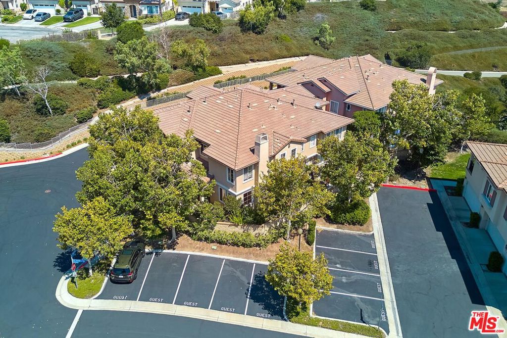 Welcome to 28058 N. Dickason Dr., Valencia. A Bright & Spacious Townhouse in the Desirable Cornerstone Community. Step into this updated 3-bedroom, 3 bathroom townhouse, offering comfort and convenience in one of Valencia's most sought-after neighborhoods. The main level features a welcoming living and dining area adjacent to the kitchen, along with a large walk-in pantry for ample storage. A bedroom and bathroom on the first floor provide flexibility for guests, a home office, or multigenerational living. There's also a spacious laundry area with room for a full-size washer and dryer, plus space for an extra refrigerator or additional storage. Upstairs, you'll find the primary suite and an additional bedroom both with en-suite bathrooms. Enjoy your own private patio, perfect for gardening, outdoor dining, or simply relaxing in the sun. This move-in-ready home features fresh paint and new carpet throughout. Cornerstone community offers excellent amenities including pool, spa, hot tub, BBQ area, and playground. Conveniently located near top-rated schools, shopping, dining, and easy freeway access. Listing agent is related to the seller. All information is deemed reliable but not guaranteed. Buyers are advised to independently verify all details, including but not limited to HOA documents, fees, community amenities, management, property size, and features.