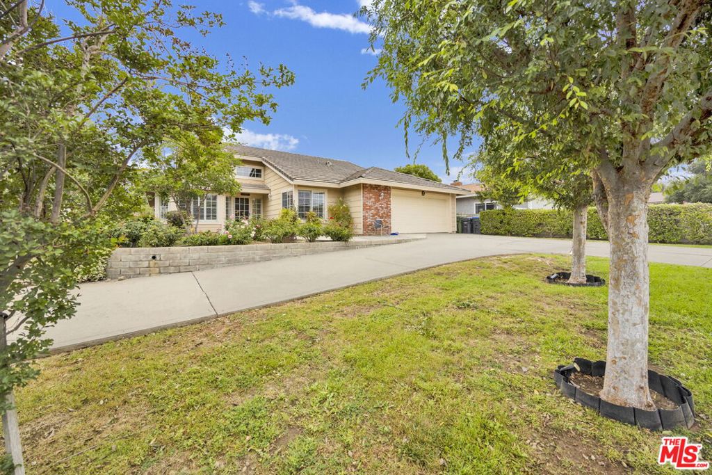 Welcome to 28461 Driver Avenue - A rare gem with endless potential, nestled in the heart of coveted Old Agoura, where scenic trails, equestrian properties, and the neighborhood's charm shine through. Built and lovingly maintained by the original owners, this expansive single-story ranch-style home offers approximately 3,500 sq ft of living space, including a recently constructed 750 sq ft casita, all set on a generous ~half-acre gated and private lot. Designed for versatility and comfort, the layout is ideal for multigenerational living, featuring five bedrooms, four bathrooms, and a bonus room with a kitchenette perfect for a playroom, home office, or gym. Whether you're hosting extended family or providing independence for young adults, the flexible floor plan offers the perfect balance of privacy and connection. Step inside to find vaulted ceilings, plantation shutters, and timeless flooring that enhance the home's warmth and charm. A formal dining room with bay window, a sun-drenched living room, and a thoughtfully renovated guest bathroom add to the inviting ambiance. Located in the highly acclaimed Las Virgenes Unified School District, the property is just minutes from top-rated schools, charming local shops, dining, and hiking trails at Cheeseboro and Palo Comado Canyons. Old Agoura's equestrian-friendly zoning and tranquil atmosphere offer a rare opportunity to enjoy a rural lifestyle while staying close to everyday conveniences and freeway access. With only half the lot currently developed, the possibilities are endless - add a pool, a barn, a second unit, or a luxurious outdoor entertaining space. Additional highlights include a two-car garage, ample driveway parking, and mature trees and landscaping that frame the serene setting. Live comfortably today while planning for tomorrow. Whether you're seeking a forever home with room to grow or a compelling investment opportunity, this is a truly special property in one of Agoura's most desirable and storied neighborhoods.