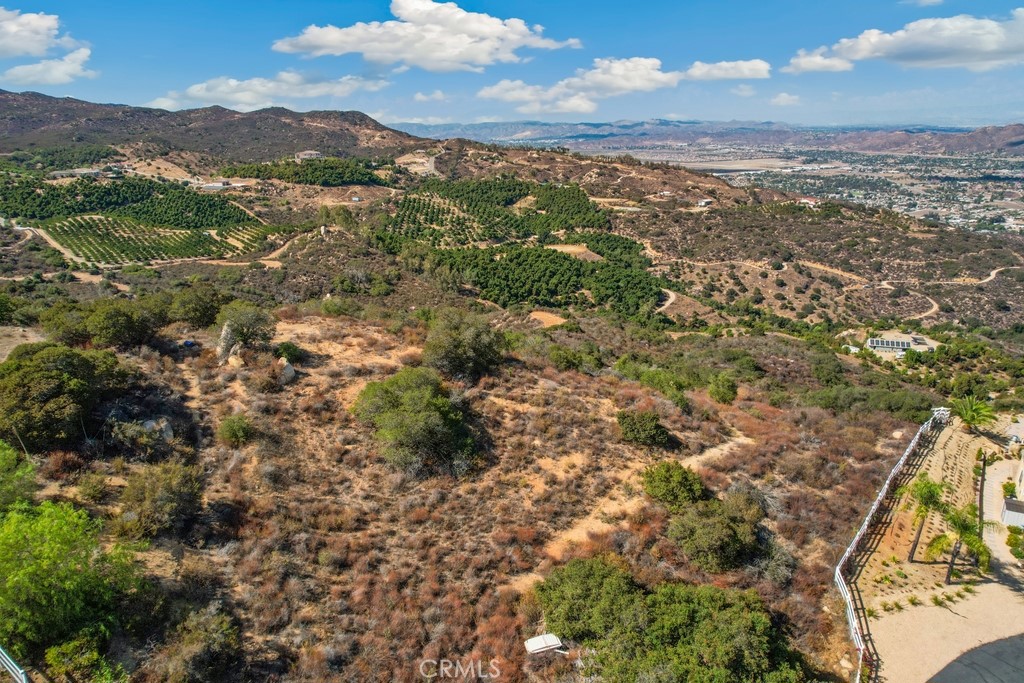 La Cresta 10+ Acres – Panoramic Views! Build your dream estate on this 10+ acre parcel with sweeping Murrieta views. Gently rolling terrain, direct trail access, and surrounded by luxury homes. Grading permit and plans for a 2,600 sq ft custom home with 3-car garage are already in process. Water meter installed; utilities nearby. Offers the perfect blend of privacy and accessibility.