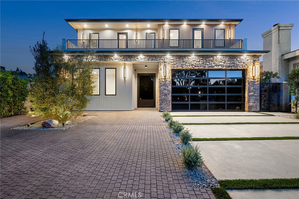 Experience an extraordinary newly constructed estate that redefines luxury in the heart of Encino. Built by a highly acclaimed local builder and designer known for visionary design, craftsmanship, and high-end materials, this custom modern farmhouse offers 7 bedrooms, 5.5 bathrooms, and a fully equipped 2-bedroom ADU. From custom paneled accent walls and designer finishes to seamless indoor-outdoor flow, every detail has been thoughtfully curated. Step inside to soaring ceilings, a dramatic stone feature wall, and wide-plank oak flooring throughout. The gourmet kitchen is a true showstopper, outfitted with top-of-the-line appliances, a wine and beverage cooler, imported porcelain counters, and an oversized island with smart storage and seating. A dream-come-true for any culinary enthusiast. The adjacent dining room impresses with a stone accent wall, while the family room centers around a designer fireplace in a stunning mix of stone and warm wood tones, finished in custom hues inspired by a Tulum resort, bringing warmth, sophistication, and a touch of vacation serenity into your everyday living space. Floor-to-ceiling pocket doors disappear into the wall, effortlessly extending your living space outdoors. on the main level, enjoy your own in-home cinema, designed for the ultimate movie night experience, alongside an ensuite guest bedroom and a stylish mudroom. Ascend the floating staircase, framed by a custom indoor garden and Venetian plaster finishes, to discover upstairs four spacious en-suite bedrooms, a laundry room, including a luxurious primary suite with a fireplace, private balcony, custom walk-in closet, and an ultra-luxurious spa bathroom with soaking tub, oversized rain shower, dual vanities, and a makeup station. Step outside to your private five-star resort with pool and spa, full outdoor kitchen, built-in BBQ, bar seating, and a fully covered patio for al-fresco dining and entertaining with family and friends. The 2-bedroom ADU with kitchenette and full bath is ideal as a guest house, pool cabana, or office. Enjoy additional amenities such as a full smart home system indoor & outdoor speakers & security cameras, alarm features as well as a gated driveway. The home is located within the top-rated Encino Charter Elementary School district and just moments from Ventura Boulevard’s premier shops, dining, and convenient freeway access.Designed to impress and built to last, this home is a rare find in one of Encino’s most desirable neighborhoods