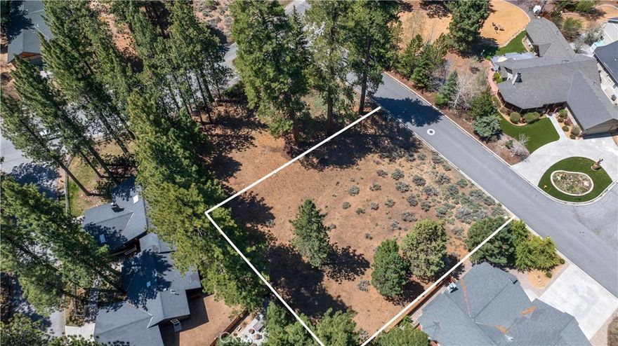 Seize a rare opportunity to own a piece of paradise in the prestigious Eagle Point Estates, one of Big Bear Lake's most coveted neighborhoods. This exceptional large, flat lot is the ideal foundation for building your dream home, complete with exclusive boat dock access to the shimmering waters of Big Bear Lake. Imagine the joy of designing your own custom mountain home, perfectly tailored to meet all your needs and desires, set amidst a community renowned for its tranquility and scenic beauty.



The property offers underground utilities, ensuring unobstructed views and a pristine landscape. Enjoy community amenities such as a private tennis court, a beach, and a park with a playground and picnic areas, all within a short stroll from your dock. This lot's prime location also boasts convenient proximity to all the attractions and activities Big Bear has to offer, making it a superb choice for those seeking a vibrant and luxurious mountain lifestyle. With very few lots remaining in this sought-after area, this is an opportunity you don't want to miss. No address has been assigned for this property