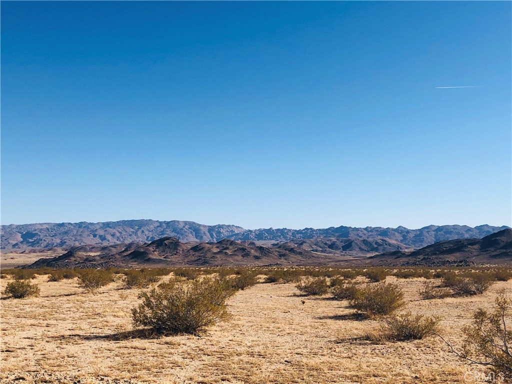 Private 4.56 acres with spectacular unobstructed desert and mountain views. Fantastic potential to be your off-the-grid sanctuary to take in the unforgettable sunsets and stargazing. Explore the areas endless hiking and off-roads trails! 10 minutes from Joshua Tree Lake Campground and 20 minutes from Joshua Tree National Park. Property does not have an assigned address - for listing purposes only. APN: 0632-111-46-0000 GPS: (34.2195920, -116.2233681)