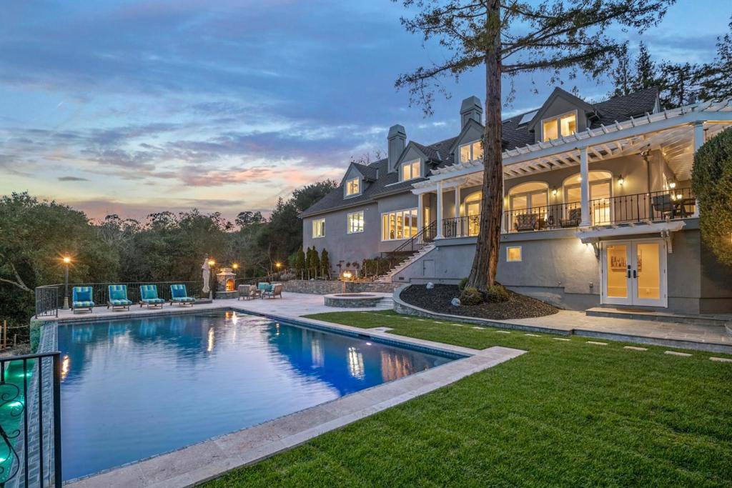 Fabulous views of the LG mtns in close proximity to Town of Los Gatos is this magnificent estate in a lovely enclave. Exquisite property offers privacy & tranquility being situated at the end of a lane and backing to Worcester Park with all its serenity. Proximity to shops, freeways, & schools. Previous and current owners have invested handsomely in upgrading int & ext. Floor plan is highly functional, design is elegant, warm & inviting.4 en-suite bdrms on 2nd story incl primary suite-amenities incl sitting rm w/fireplace, bath w/ mahogany cabs &walk-in closet. Two offices, one being a bright conservatory. Kitchen is a dream w/ large island, high quality appliances & mahogany cabs, all open to fam rm w/views of mtns. Sep dining rm & elegant living room. Additional rms incl a gym w/full bath, temp controlled wine rm & 3 car gar. Grounds are lovely w/ beaut amenities incl outdoor cooking fac, infinity edge pool, spa, entertainment patios, fireplace, vineyard, veg & rose gardens. LG Schls