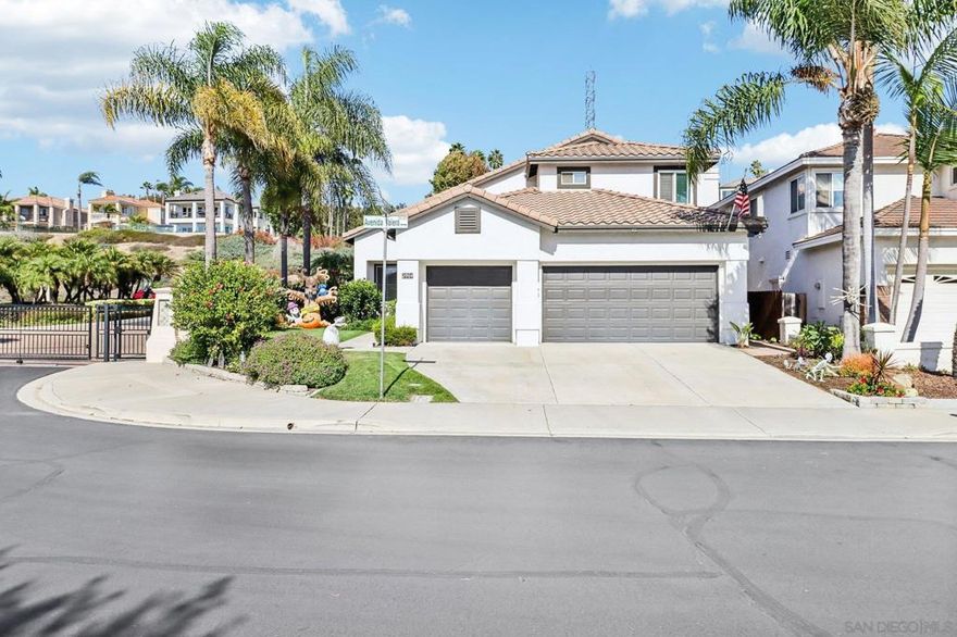 Set within the prestigious gated community of The Fairways at La Costa Valley, this beautifully maintained 4-bedroom, 3-bathroom residence offers 2,412 square feet of thoughtfully designed living space. Flooded with natural light and showcasing soaring vaulted ceilings, the open floor plan is perfect for both entertaining and everyday living. The spacious family room centers around a custom stacked stone gas fireplace—ideal for cozy evenings. The chef’s kitchen and living areas seamlessly connect to a backyard retreat featuring mature landscaping and a spa, creating a private sanctuary. Upstairs, the primary suite includes architectural details, a garden soaking tub, and generous closet space. Additional bedrooms provide flexibility for guests, office space, or hobbies. Situated on a corner lot, the backyard features mature landscaping and a private spa for relaxation. This corner-lot location ensures privacy and tranquility in a quiet, established neighborhood.