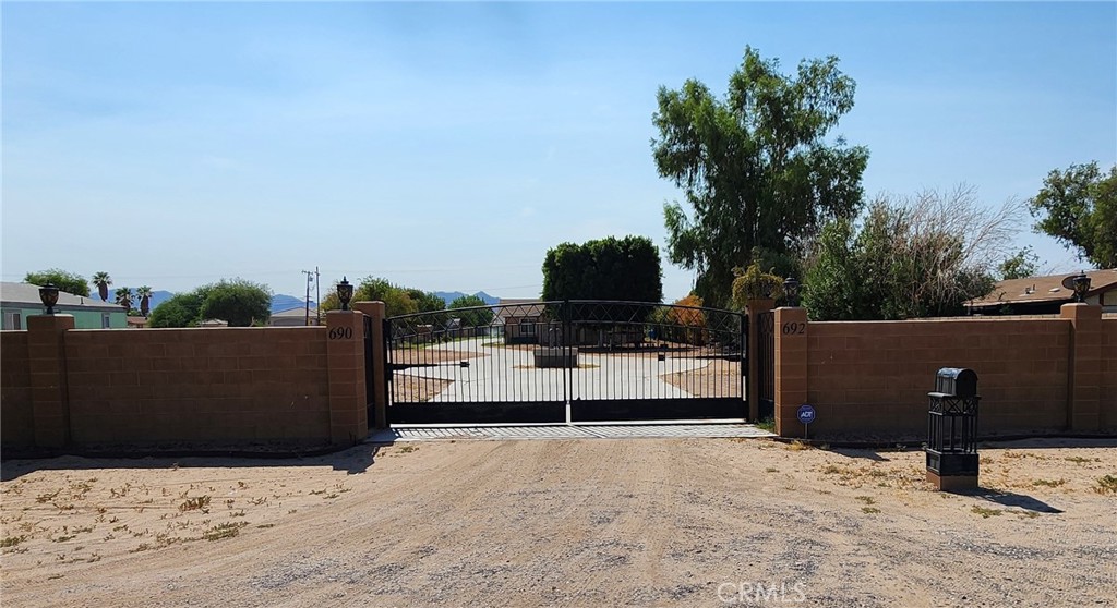 Welcome to your very own desert oasis, nestled along the Colorado River! This deeded 1-acre lot is RIVERFRONT and located in the well-known Riviera Drive community, a family-friendly neighborhood that includes a private launch ramp for convenient river access. This gated property features 2 separate homes with over 2,700 sq ft of living space, a standard 2-car garage, huge RV garage/shop, tons of additional parking for your vehicles and ample space to store all your toys. And did I mention the 2 solar systems that power both houses, garage and shop? Whether you’re relaxing on the patio with a cold beverage and taking in the panoramic river views, enjoying nature, or swimming and sunbathing on your own private beach, this is an outdoor enthusiast’s dream!!! Don’t miss your opportunity to own a little slice of heaven on the Colorado River!