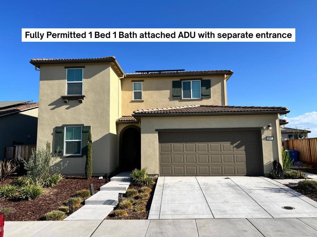 Built in 2023 / 2024, this NextGen Lennar home provides more space without compromising privacy or independence. Main house has 4 bedrooms / 3 bathrooms and includes an attached, permitted 1 bedroom / 1 bathroom private suite like an ADU, with a separate entrance, that is part of the original builder floorplan. This 1/1 suite has it's own wet bar / kitchenette, living room, bedroom with ensuite bathroom, and laundry area. In the main home, 1 bedroom and 1 full bathroom are downstairs, as well as a large den / office. The other 3 bedrooms and 2 bathrooms are upstairs, along with the loft and laundry room. Spacious and inviting ~3,232 square foot layout, on a ~5,948 square foot lot. Primary bedroom has a walk-in closet and ensuite bathroom with an oversized tub and double sinks. The generously sized kitchen is equipped with quartz countertops, a built-in oven range with gas, dishwasher and microwave. The home is designed for comfort and convenience, with high ceilings, tons of storage and an open floorplan kitchen and family room. Enjoy the benefits of modern energy features like double pane windows, solar power, and a tankless water heater. Dual zone heat and AC. This beautiful home is priced to sell - come see it before it's gone! Professional photos will be added ASAP.