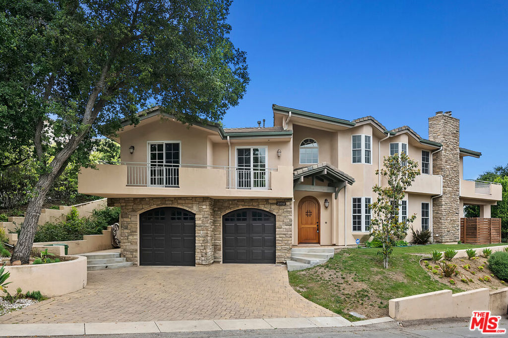Presenting this beautiful and spacious "Calabasas Highlands" custom build home with nature views. Nestled in the hills of Calabasas, this 4 bed 5 bath home features a formal entry with vaulted ceilings, wood floors and recessed lighting throughout. The kitchen features granite slab counter-tops and stainless steel appliances. A breakfast bar opens to the family room with a fireplace. Each bedroom has en-suite bathrooms, picturesque windows, and a balcony or patio space. The primary suite is expansive with vaulted ceilings, fireplace, massive walk-in closet, over-sized shower and Jacuzzi tub & large balcony with views. Las Virgenes School District.