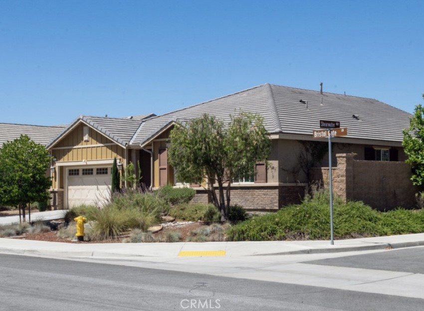 Welcome to this beautiful single-story corner-lot home located in one of Menifee’s most desirable gated communities, offering access to a gym, sparkling pool, relaxing hot tub, splash pad, and a park directly across the street.
Step inside to a spacious entryway that leads into an open-concept living area filled with natural light from large windows and high ceilings throughout. The home features 3 bedrooms plus a versatile bonus room that can be used as an office, den, or 4th bedroom, and 2 full bathrooms, each with double sinks.
The modern kitchen is a chef’s dream, complete with granite countertops, stainless steel appliances, a double oven, a large center island, and ample cabinet space. The kitchen seamlessly connects to the dining and living areas — perfect for entertaining.
The primary suite offers a luxurious retreat with a separate soaking tub and shower, dual vanities, and a large walk-in closet with custom shelving. Every bedroom includes a ceiling fan for year-round comfort.
Additional highlights include:
Tile and vinyl flooring throughout for easy maintenance
Laundry room with custom shelving and cabinetry
Spacious hall closet and abundant storage
Attached 2-car garage with automatic opener
Neutral modern finishes ready for your personal touch
Enjoy both comfort and convenience in this move-in-ready Menifee home — where style, functionality, and community amenities come together perfectly.