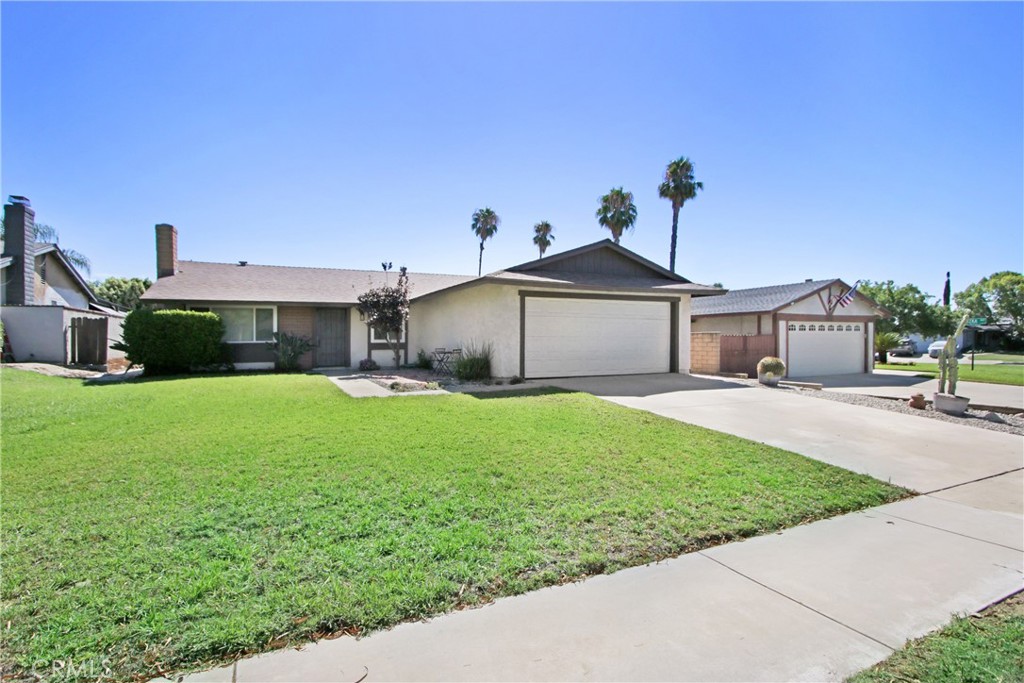 Not only is this rare single story home absolutely beautiful, it has the updates that really matter! Brand new Roof! New dual pane vinyl windows throughout! Brand new carpet. Modern upgrades throughout such as recessed lighting and newer light fixtures. Updated kitchen with a stylish theme of slate countertops & flooring carrying through to the bathroom. The stunning curb appeal is equally matched out back with its massive size and expansive hardscaping. To top things off there is a giant pomegranate tree that bears bountiful fruit for months!