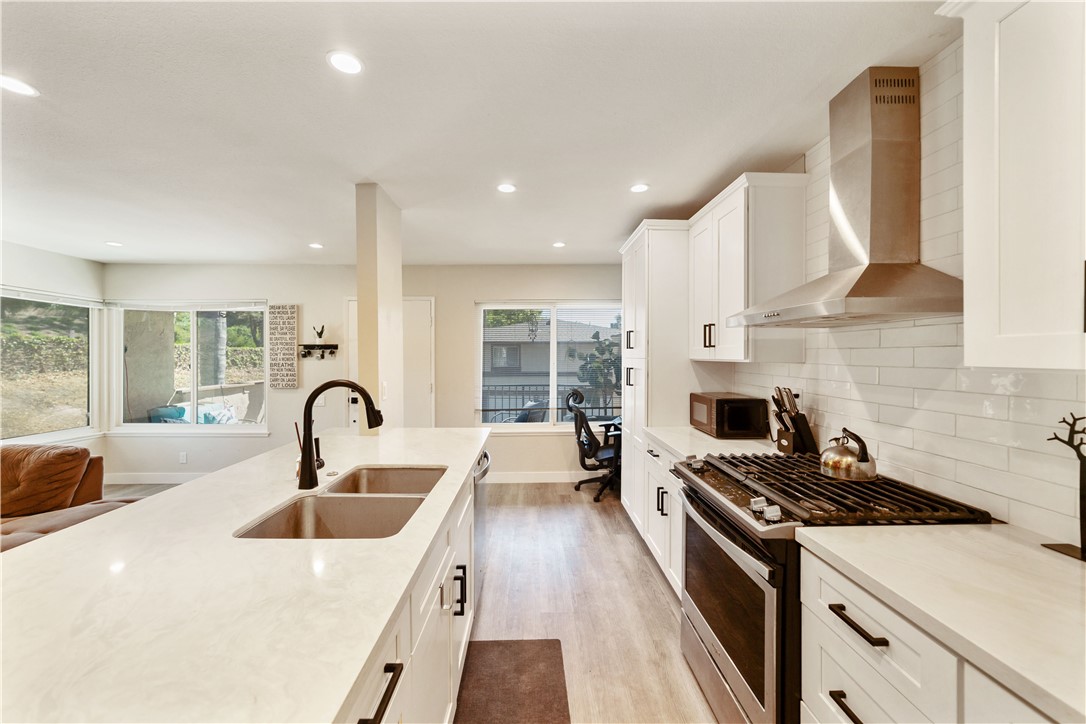 Welcome to this stunning, newly remodeled end-unit condo nestled in a peaceful wooded community of Mission Viejo. Surrounded by mature trees with a serene creek just beyond the property, this home offers the perfect balance of nature and convenience. Featuring an open and airy floor plan, this light-filled home boasts two fully renovated bathrooms, elegant new flooring, renovated kitchen with quartz countertops, and modern shaker-style cabinets throughout. The spacious living and dining areas flow seamlessly, creating an ideal space for relaxing or entertaining. Enjoy your morning coffee on the inviting front patio, or take advantage of the walking and biking trails just steps away. The oversized one-car garage includes extra storage and a convenient side entry door located right at the bottom of the stairs leading to the home. This end unit is ideally located near guest parking and is just a short drive to Lake Mission Viejo, shopping centers, restaurants, and more. Don’t miss this rare opportunity to own a beautifully updated condo in one of Mission Viejo’s most tranquil settings!