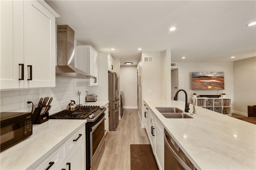 Welcome to this stunning, newly remodeled end-unit condo nestled in a peaceful wooded community of Mission Viejo. Surrounded by mature trees with a serene creek just beyond the property, this home offers the perfect balance of nature and convenience. Featuring an open and airy floor plan, this light-filled home boasts two fully renovated bathrooms, elegant new flooring, renovated kitchen with quartz countertops, and modern shaker-style cabinets throughout. The spacious living and dining areas flow seamlessly, creating an ideal space for relaxing or entertaining. Enjoy your morning coffee on the inviting front patio, or take advantage of the walking and biking trails just steps away. The oversized one-car garage includes extra storage and a convenient side entry door located right at the bottom of the stairs leading to the home. This end unit is ideally located near guest parking and is just a short drive to Lake Mission Viejo, shopping centers, restaurants, and more. Don’t miss this rare opportunity to own a beautifully updated condo in one of Mission Viejo’s most tranquil settings!