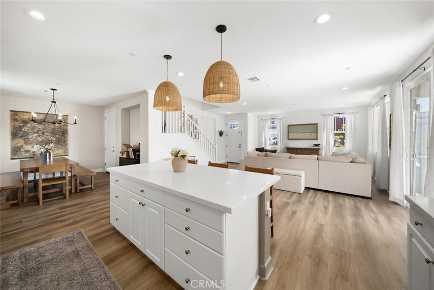 Built in 2022, this corner-lot home combines modern design, custom details, and flexible living spaces. Featuring 3 bedrooms, 2.5 baths, and 2,006 sq. ft., in the main home, and also includes a 330 sq. ft. ADU with private access—ideal for guests, extended family, or rental income. Situated on one of the larger lots in the development, the property offers added outdoor space with plenty of potential for future enhancements. Inside, thoughtful upgrades set this home apart, with stylish finishes and custom touches throughout—including upgraded light fixtures, paneling in the dining room, a built-in upstairs, and a Dutch door that opens to the backyard. Outdoors, enjoy a private retreat with a built-in fireplace, perfect for cozy evenings or entertaining under the stars. Everyday convenience meets peace of mind with features like dual-owned 6.4kw solar systems with a Tesla Powerwall backup battery and generous garage storage. The open-concept layout creates a seamless flow for modern living, while the oversized lot expands the possibilities for how you can make the space your own. Turn-key, stylish, and versatile, this home offers it all—newer construction, smart upgrades, and indoor-outdoor spaces designed for both comfort and connection. Don’t miss your chance to make this home yours—schedule a showing today!